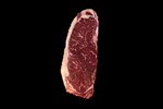 Raw steak on a black background