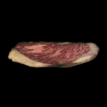 Sliced marbled beef arranged in a pyramid formation on a black background