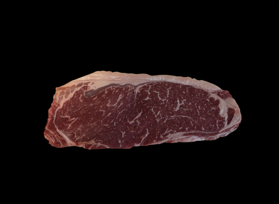 Raw steak on a black background